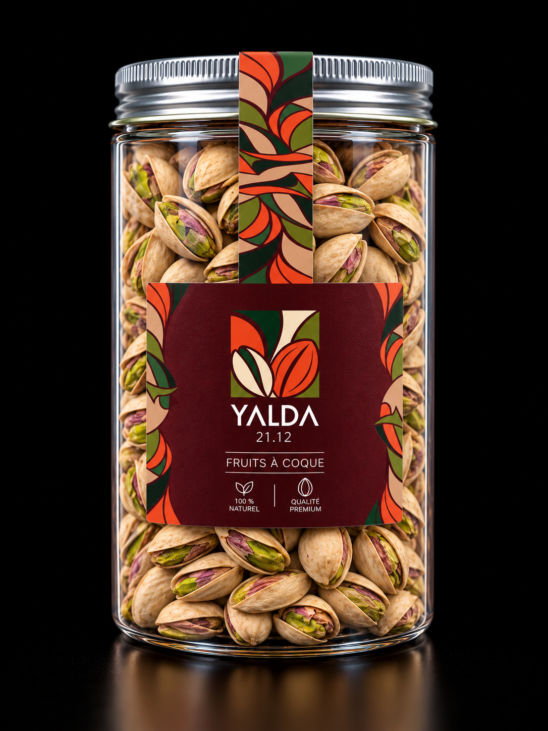 Bocal YALDA rempli de pistaches, avec étiquette végétale rouge et verte